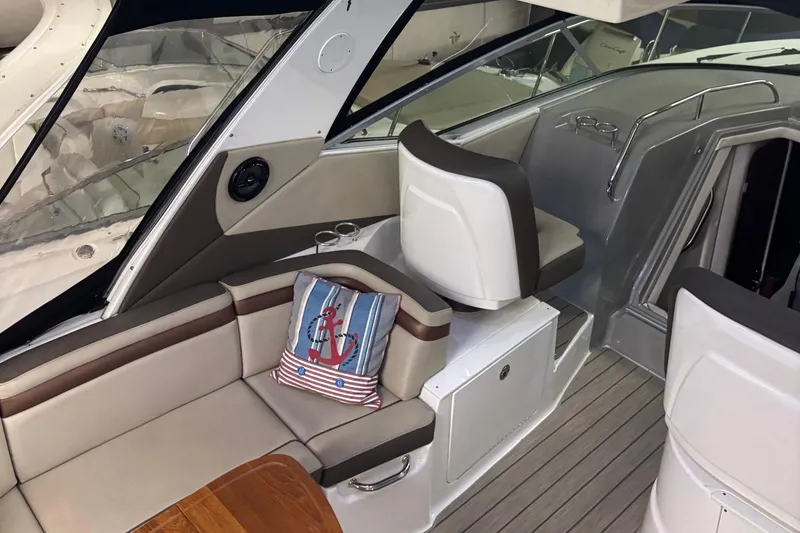 Slide: The Image of Interior of 2014 Sea Ray 370 Sundancer yacht with seating and nautical decor. - 31