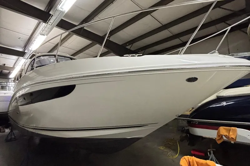 Slide: The Image of 2014 Sea Ray 370 Sundancer yacht in indoor storage facility. - 36