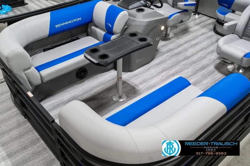 Slide: The Image of 2025 Bennington 20 SSB pontoon boat interior with blue and gray seating. - 12