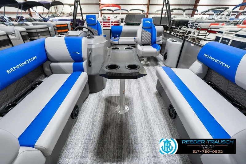 Slide: The Image of 2025 Bennington 20 SSB pontoon boat interior with blue and gray seating. - 16