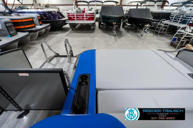 Slide: The Image of 2025 Bennington 20 SSB pontoon boat in showroom with other models. - 18