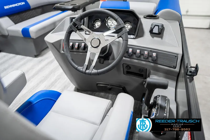 Slide: The Image of 2025 Bennington 20 SSB boat interior with steering wheel and control panel. - 30