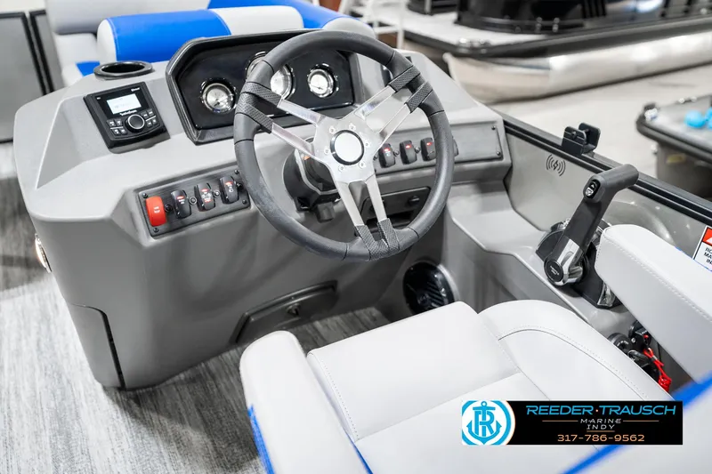 Slide: The Image of 2025 Bennington 20 SSB boat dashboard with steering wheel and controls. - 31