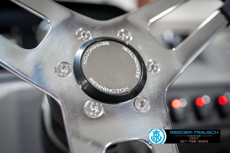 Slide: The Image of Steering wheel of 2025 Bennington 20 SSB boat, featuring sleek metallic design. - 32