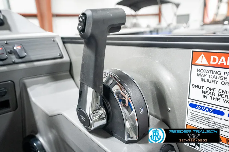 Slide: The Image of Throttle control of 2025 Bennington 20 SSB boat with warning labels and logo. - 38