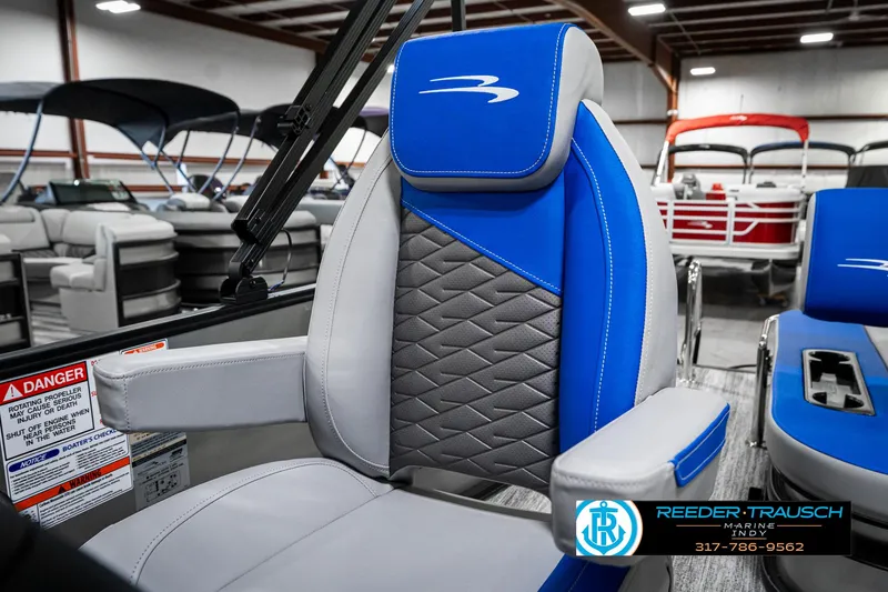 Slide: The Image of 2025 Bennington 20 SSB boat seat with blue and gray upholstery in showroom. - 39
