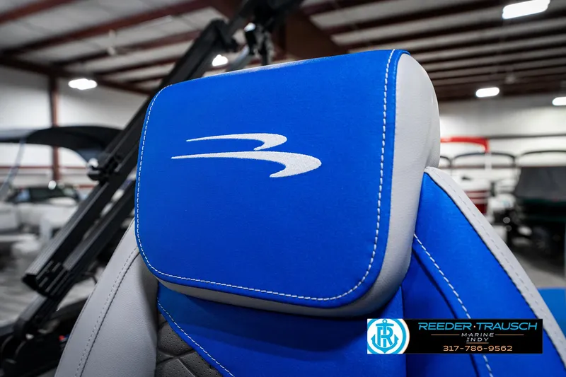 Slide: The Image of Blue and gray seat of 2025 Bennington 20 SSB boat in showroom. - 42