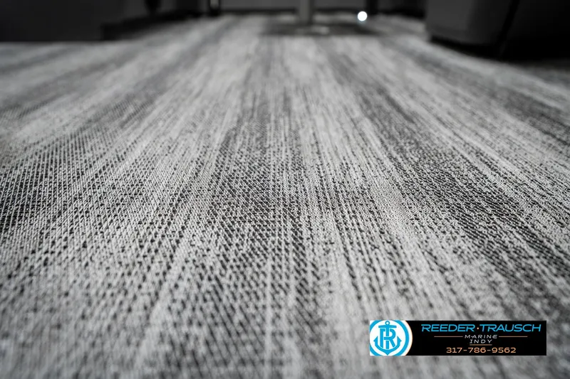Slide: The Image of 2025 Bennington 20 SSB boat interior flooring with textured design. - 47
