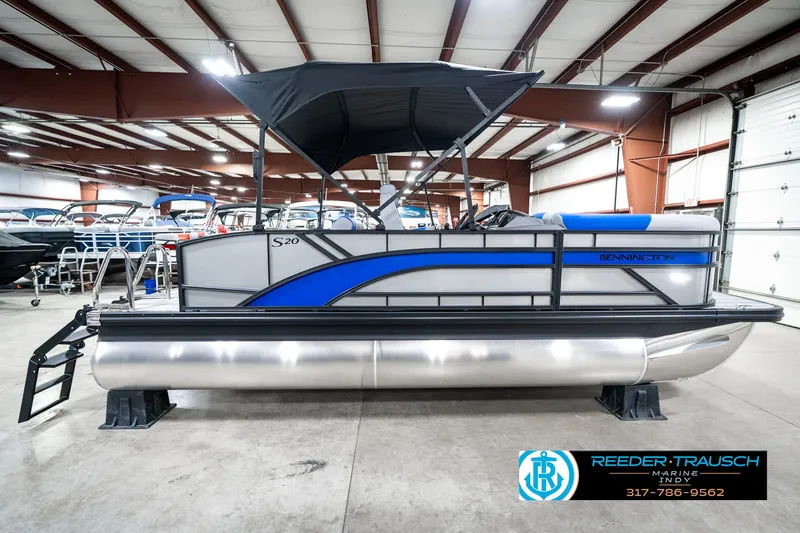 Slide: The Image of 2025 Bennington 20 SSB pontoon boat in showroom, side view with canopy. - 7