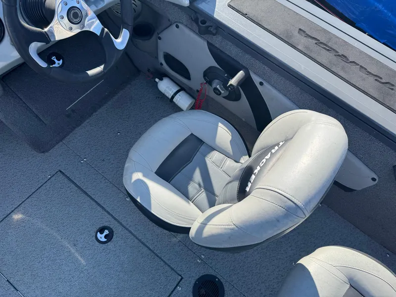 Slide: The Image of 2017 Tracker Targa V-18 Combo boat interior with steering wheel and seating. - 12