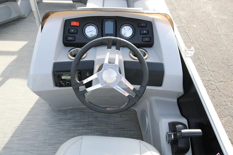 Slide: The Image of 2021 Bennington SX 20 Quad Bench steering console with gauges and controls. - 10