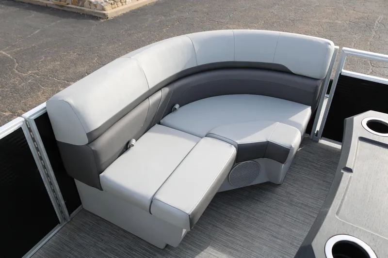 Slide: The Image of 2021 Bennington SX 20 Quad Bench with gray upholstery and cup holders on a boat deck. - 12