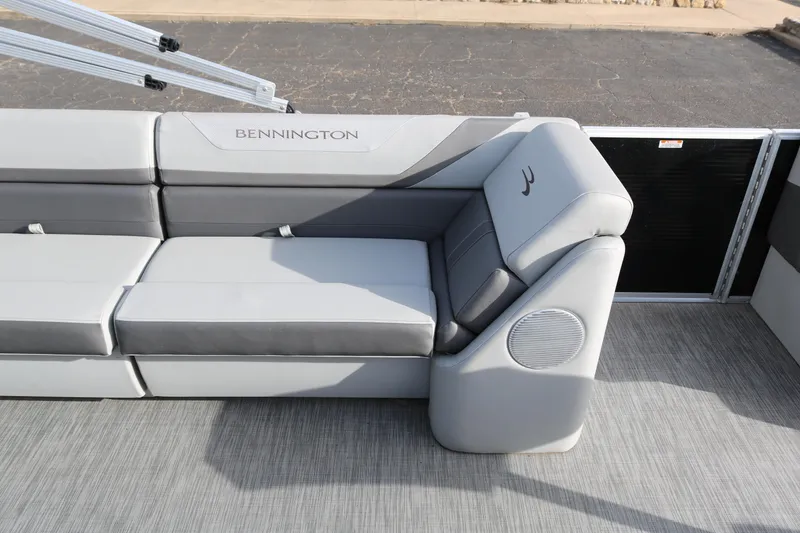 Slide: The Image of 2021 Bennington SX 20 Quad Bench with gray seating and integrated speaker. - 16