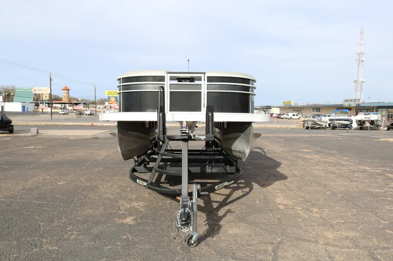 Slide: The Image of 2021 Bennington SX 20 Quad Bench pontoon boat on trailer, front view. - 2