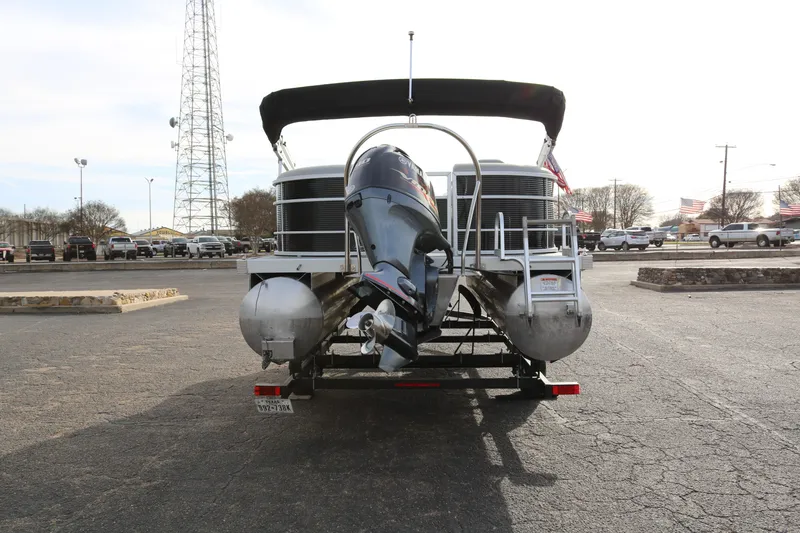 Slide: The Image of 2021 Bennington SX 20 Quad Bench pontoon boat on trailer, rear view. - 6