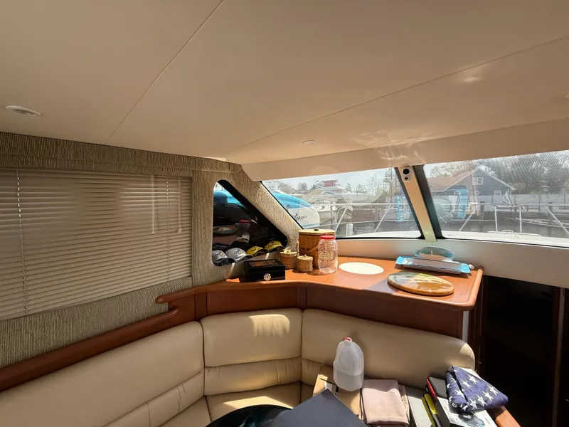 Slide: The Image of Interior of 2004 Silverton 34 Convertible yacht with seating and windows. - 21