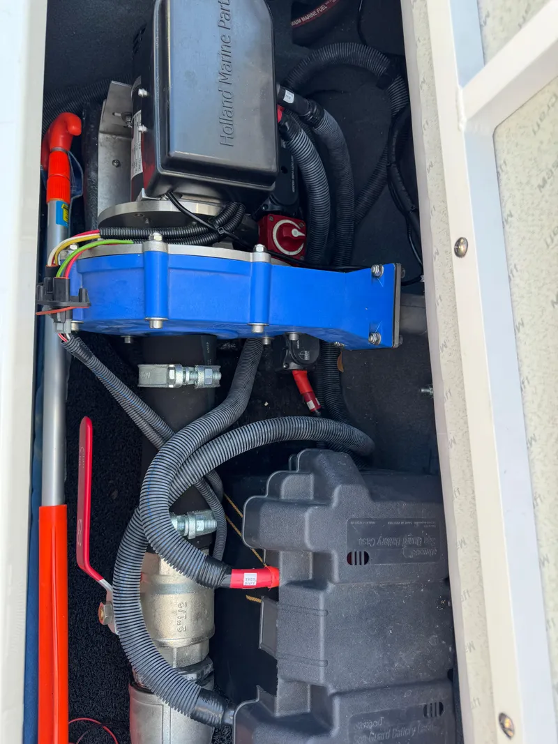 Slide: The Image of Engine compartment of a 2019 MasterCraft X46 boat, showcasing mechanical components and wiring. - 40