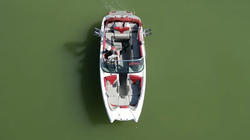 Slide: The Image of 2019 MasterCraft X46 boat on green water, aerial view. - 5