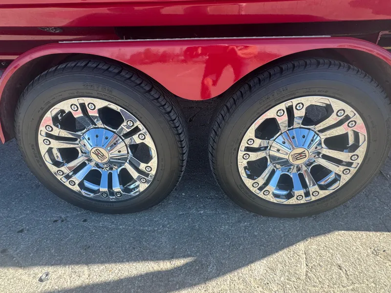 Slide: The Image of 2019 MasterCraft X46 trailer with shiny chrome wheels and red fender. - 9