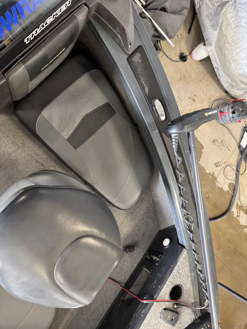 Slide: The Image of 2022 Tracker Targa V-18 Combo boat interior with seats and equipment. - 11