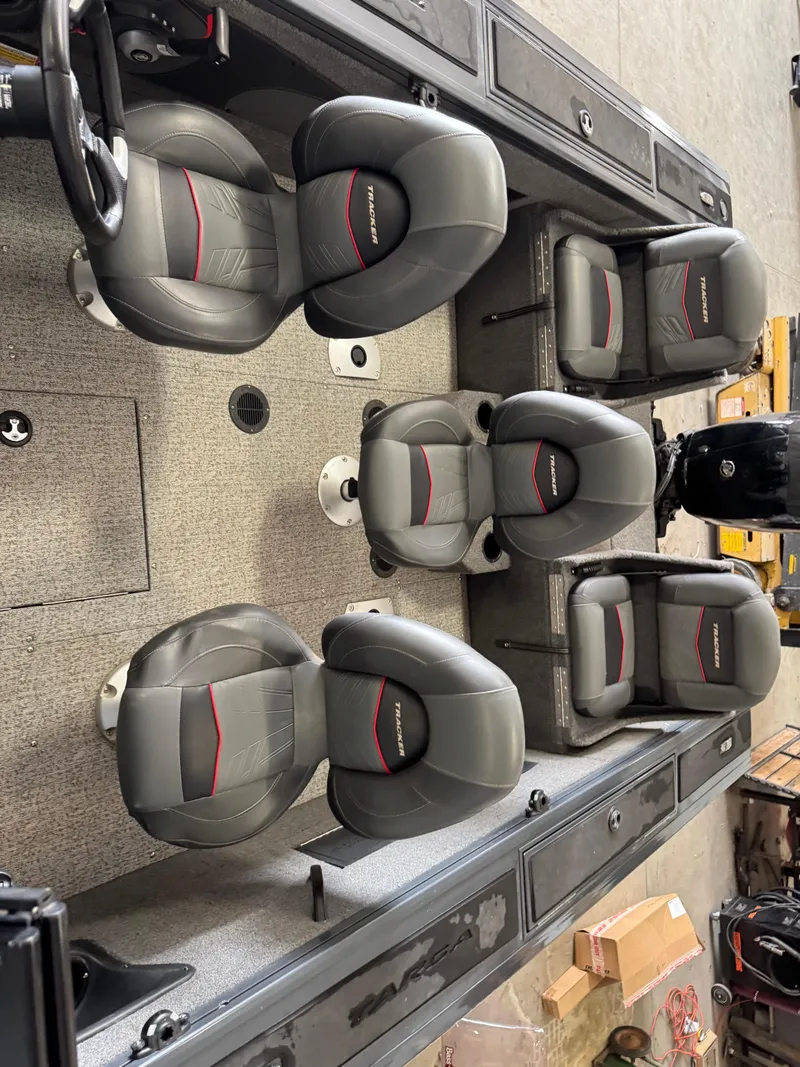 Slide: The Image of 2022 Tracker Targa V-18 Combo boat interior with six cushioned seats. - 14