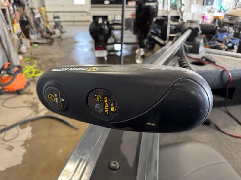 Slide: The Image of Trolling motor on 2022 Tracker Targa V-18 Combo boat in a garage setting. - 15