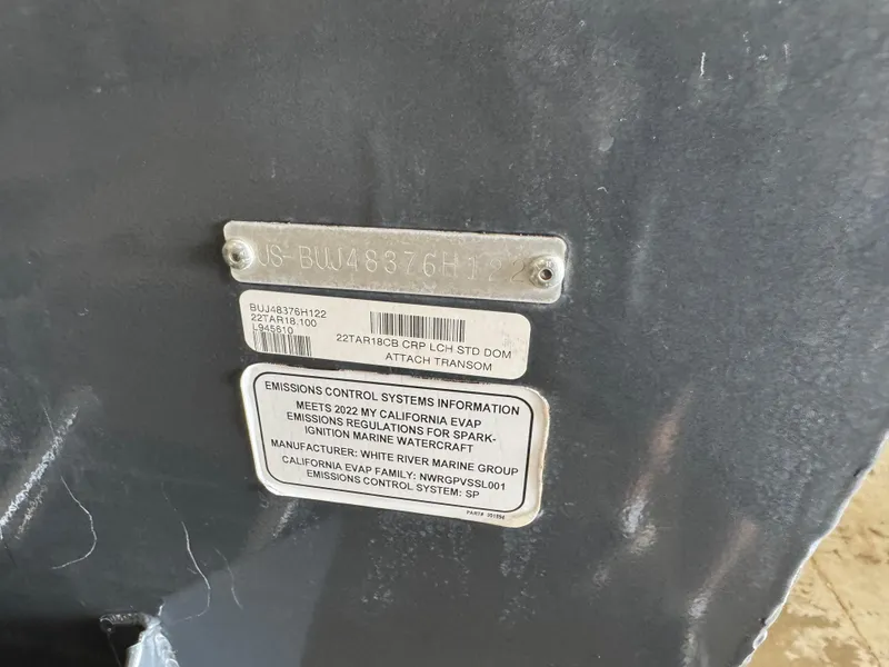 Slide: The Image of 2022 Tracker Targa V-18 Combo boat identification and emissions control labels. - 5