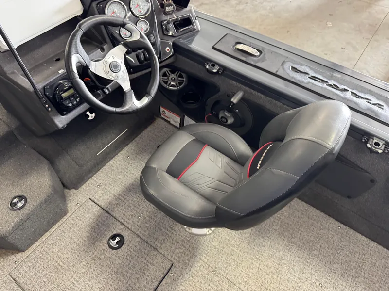 Slide: The Image of 2022 Tracker Targa V-18 Combo boat interior with steering wheel and seat. - 7