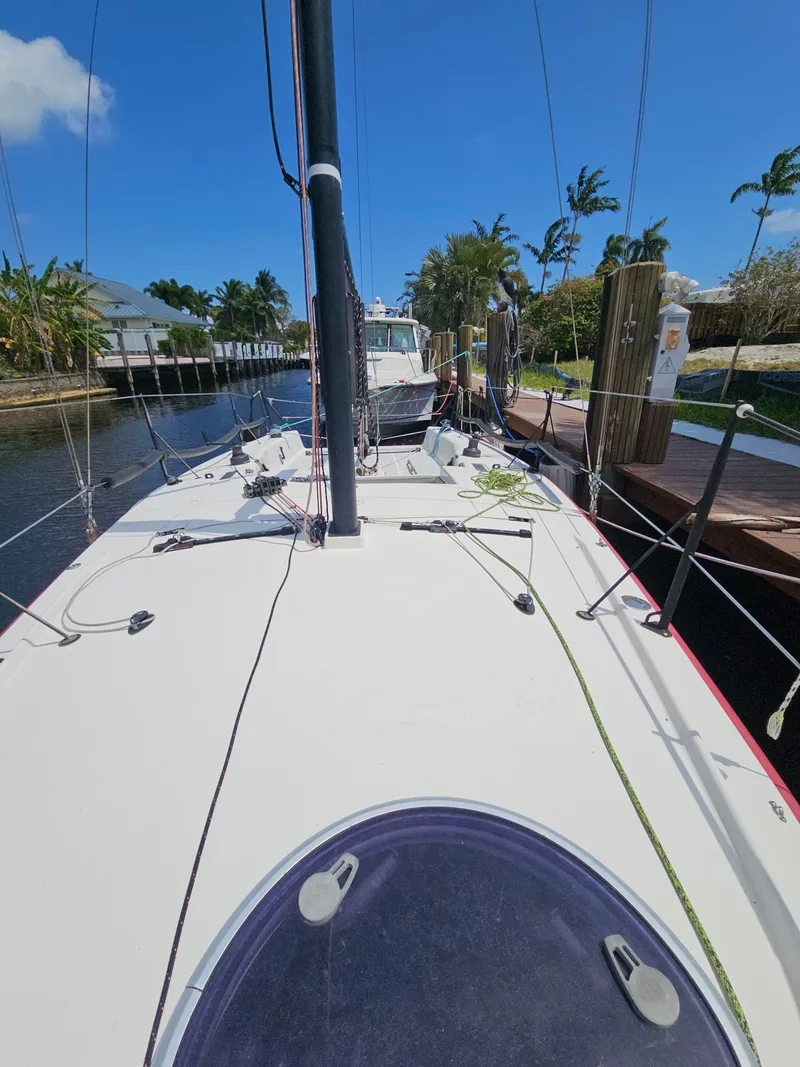 Slide: The Image of Sailboat docked in sunny marina, C&C Mega 30 One Design, 2014 model. - 10