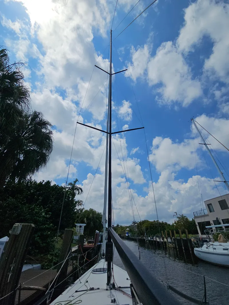 Slide: The Image of Sailboat docked under a blue sky, C&C Mega 30 One Design, 2014 model. - 11