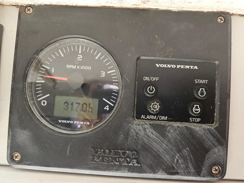 Slide: The Image of Volvo Penta engine control panel with RPM gauge and hour meter reading 3170 hours. - 15