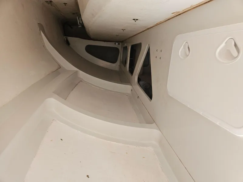 Slide: The Image of Interior view of a 2014 C&C Mega 30 One Design sailboat, showcasing its sleek, minimalist design. - 18
