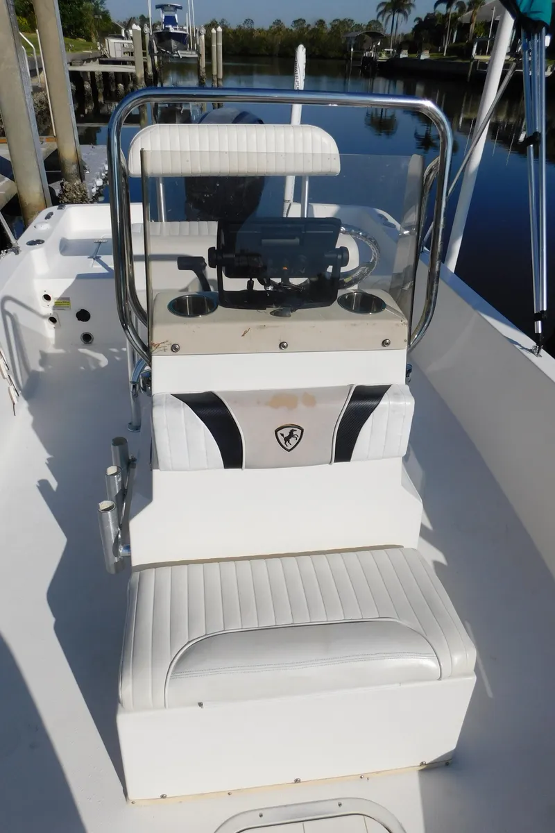 Slide: The Image of 2014 Century 2001 Bay CC boat interior with seating and console. - 12