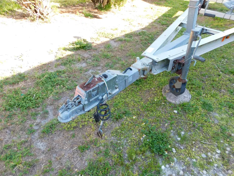 Slide: The Image of Trailer hitch of a 2014 Century 2001 Bay CC on grassy ground. - 15