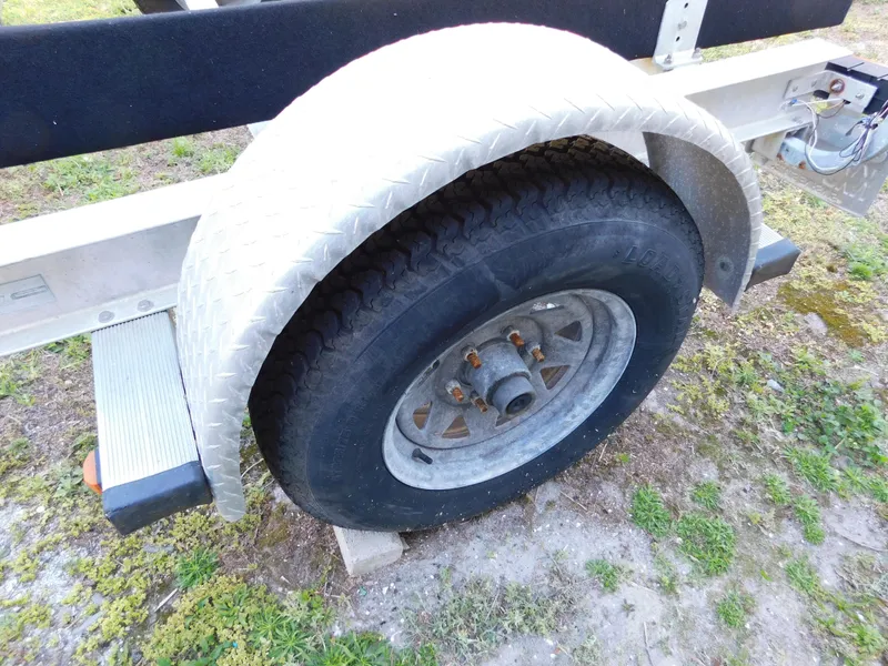 Slide: The Image of Trailer wheel with metal fender on a 2014 Century 2001 Bay CC. - 17