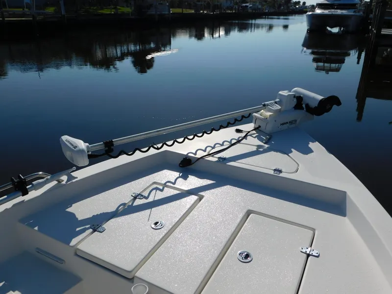 Slide: The Image of Bow of a 2014 Century 2001 Bay CC boat with trolling motor on calm water. - 6