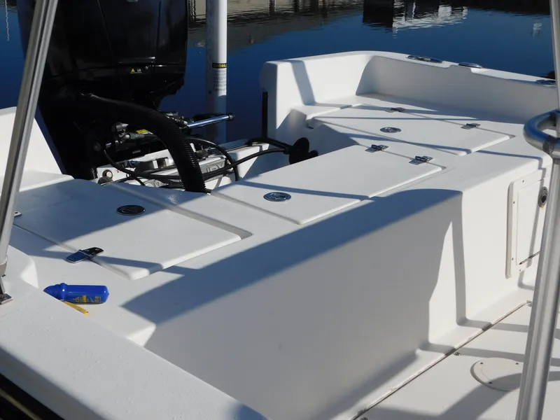 Slide: The Image of Century 2001 Bay CC boat interior, 2014 model, featuring storage compartments and engine view. - 9