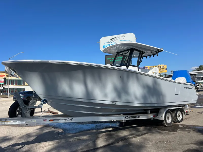 Slide: The Image of 2025 Sportsman Open 262 Center Console boat on trailer, displayed outdoors. - 1