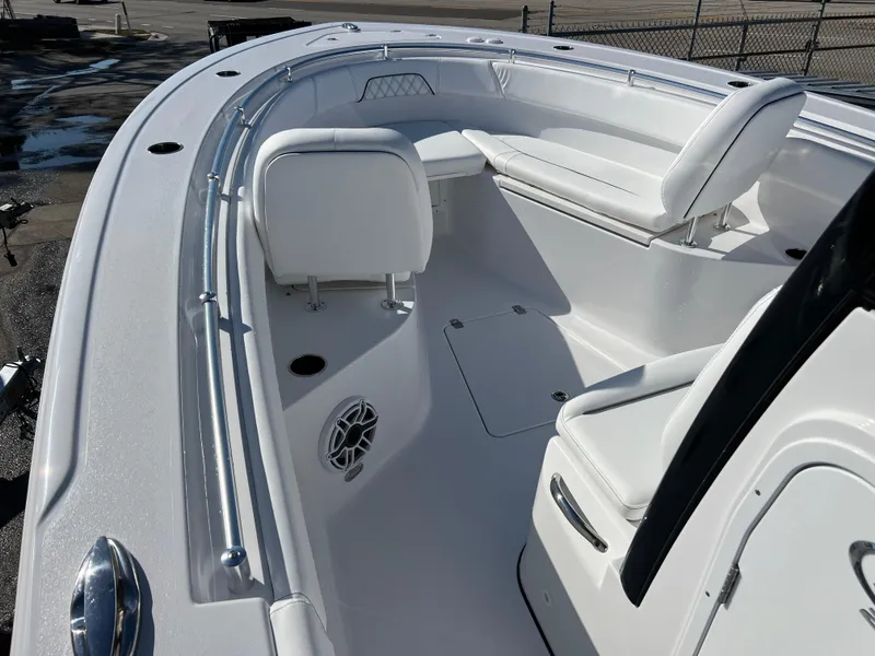 Slide: The Image of 2025 Sportsman Open 262 Center Console boat interior with white seating and sleek design. - 12