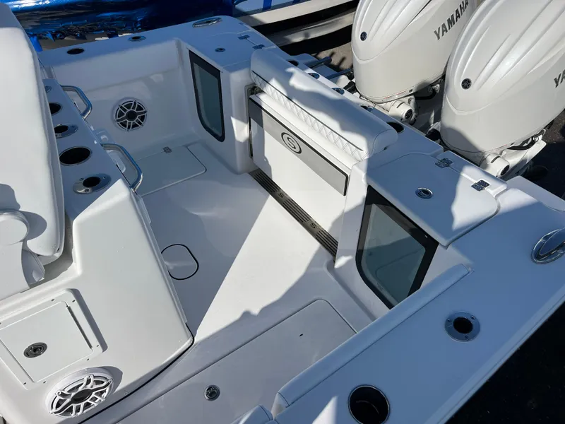 Slide: The Image of 2025 Sportsman Open 262 Center Console boat with Yamaha engines, featuring spacious deck and seating. - 17