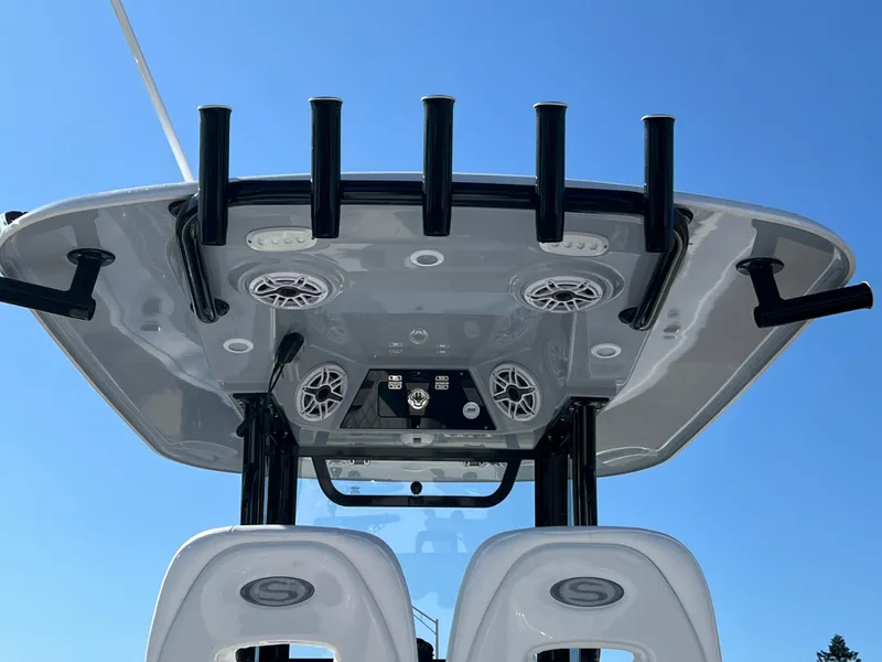 Slide: The Image of 2025 Sportsman Open 262 Center Console boat with rod holders and speakers, viewed from below. - 20