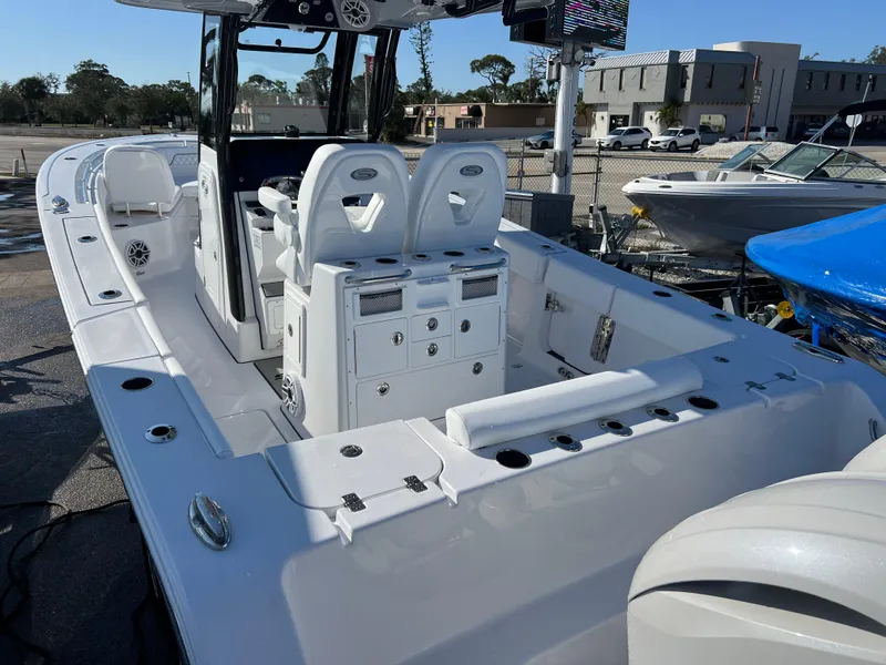 Slide: The Image of 2025 Sportsman Open 262 Center Console boat with sleek design and spacious seating. - 6