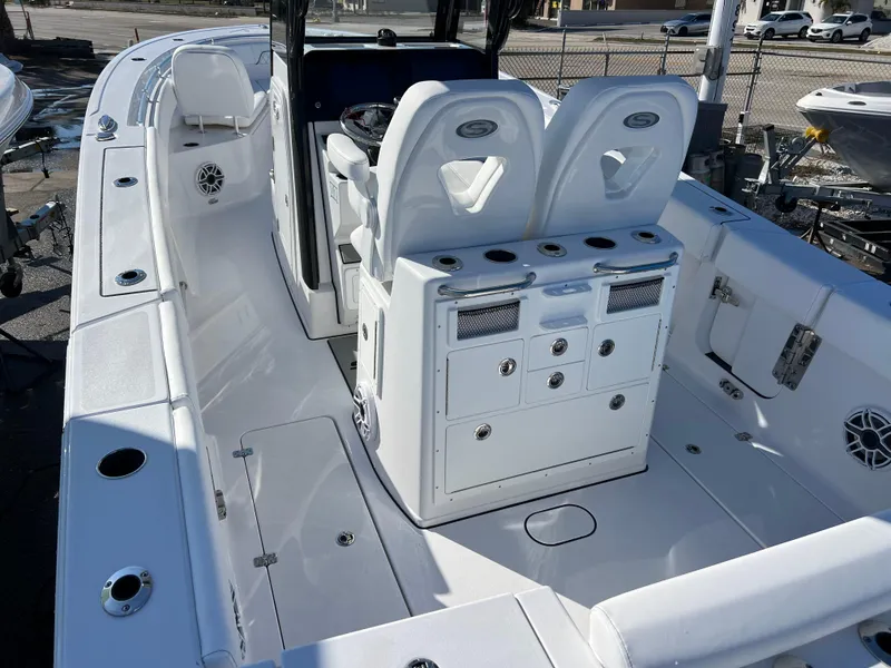 Slide: The Image of 2025 Sportsman Open 262 Center Console boat interior with seating and storage compartments. - 7