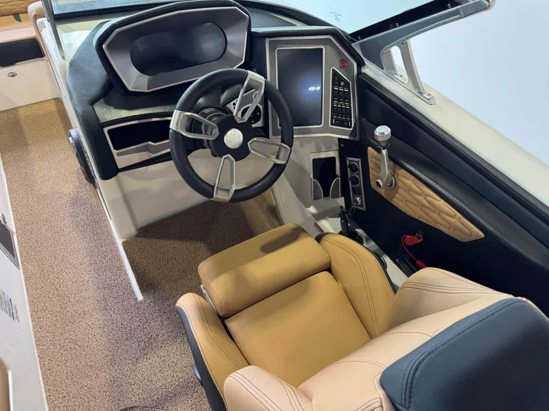 Slide: The Image of 2021 MasterCraft X24 boat interior with modern steering wheel and touchscreen controls. - 27