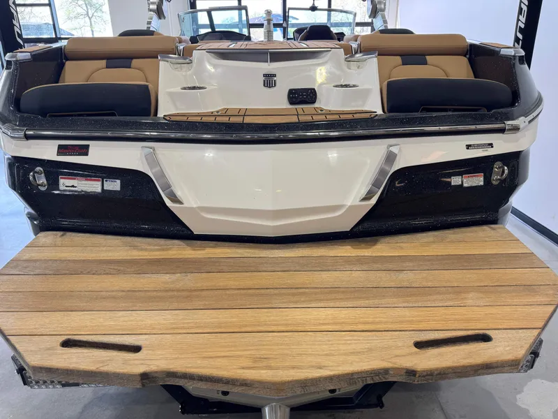 Slide: The Image of 2021 MasterCraft X24 boat with teak swim platform and luxurious seating. - 7