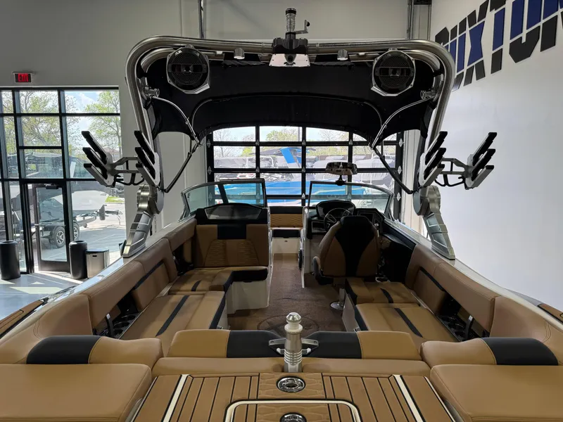Slide: The Image of 2021 MasterCraft X24 boat interior with tan seating and advanced wakeboard tower. - 8
