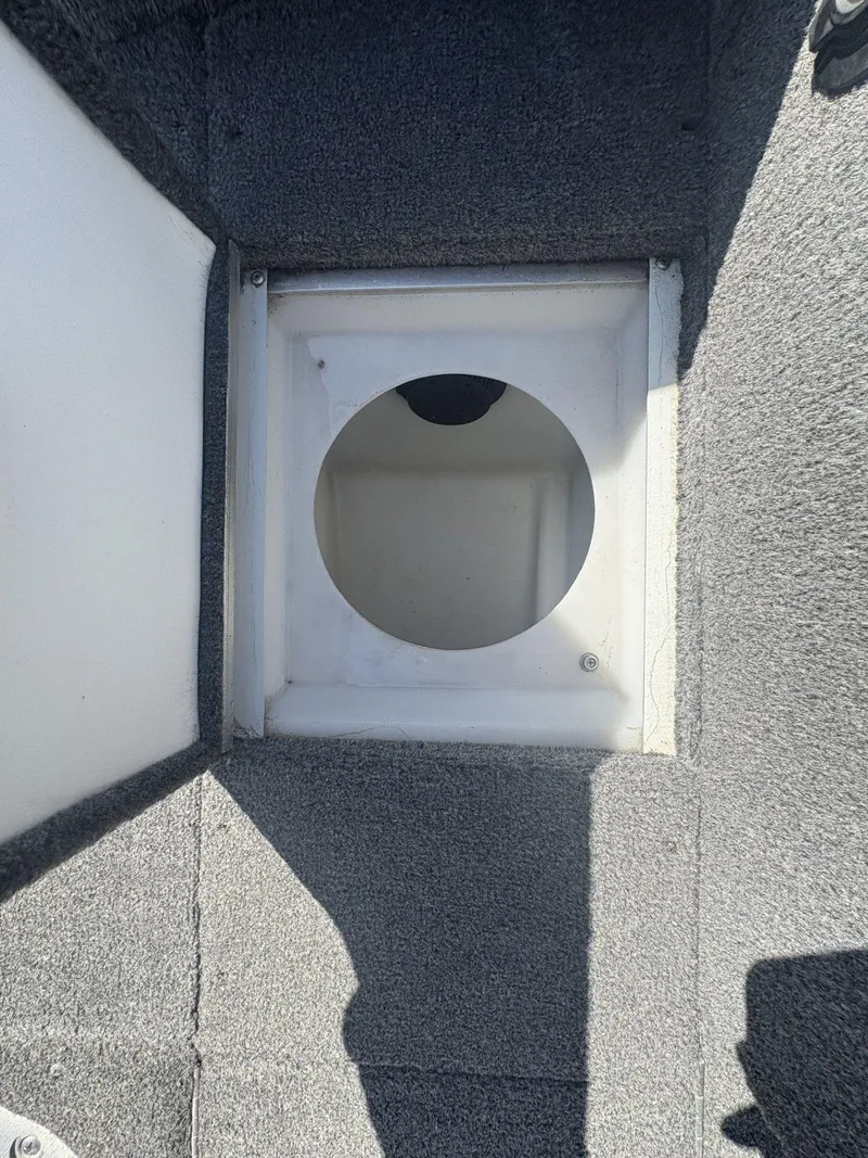 Slide: The Image of 2007 Alumacraft Navigator 165 CS boat interior with circular compartment opening. - 20