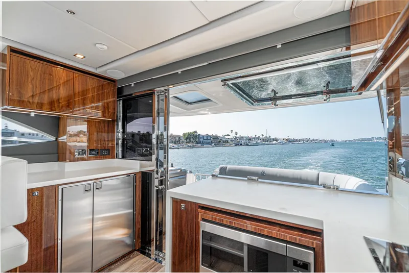 Slide: The Image of Luxurious interior of 2024 Riviera 4600 Sport Yacht with ocean view. - 36