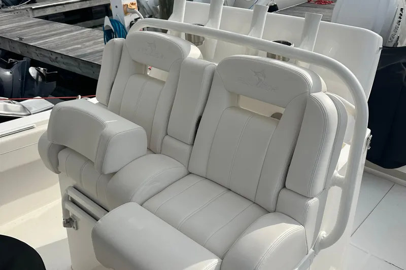 Slide: The Image of 2024 Regulator 31 boat with luxurious white seating and rod holders. - 14
