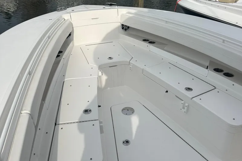 Slide: The Image of 2024 Regulator 31 boat interior with spacious seating and storage compartments. - 18